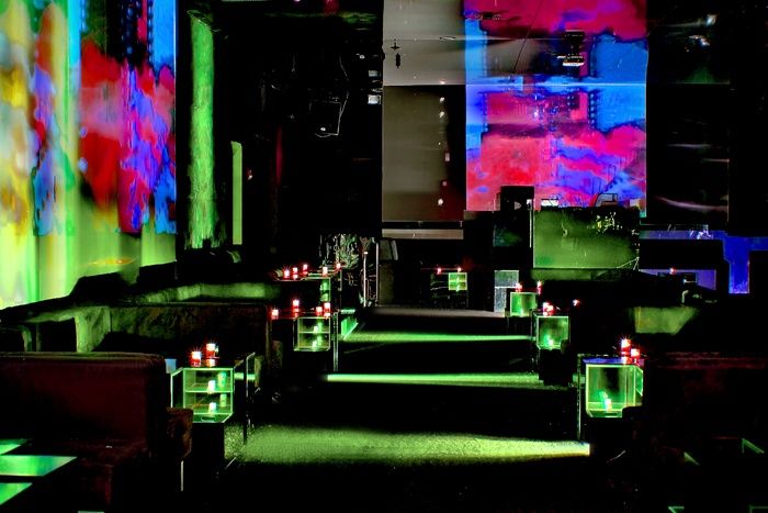Lounge interior with projection walls and low seating